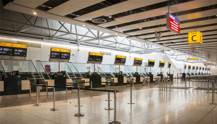 Empty check-in hall at a UK airport terminal served by XLNC Cars airport transfers